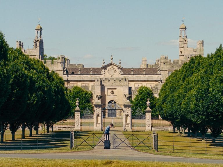 Oliver in front of his friend's mansion. image represents soundtrack for the film