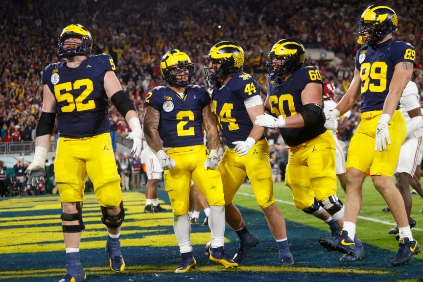 Michigan Wolverines celebrating after a touchdown