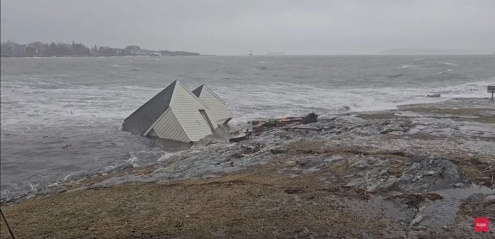 Image showing Maine fishing shacks being swept out to sea