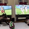 A dog leaps for joy whenever their team scores.
