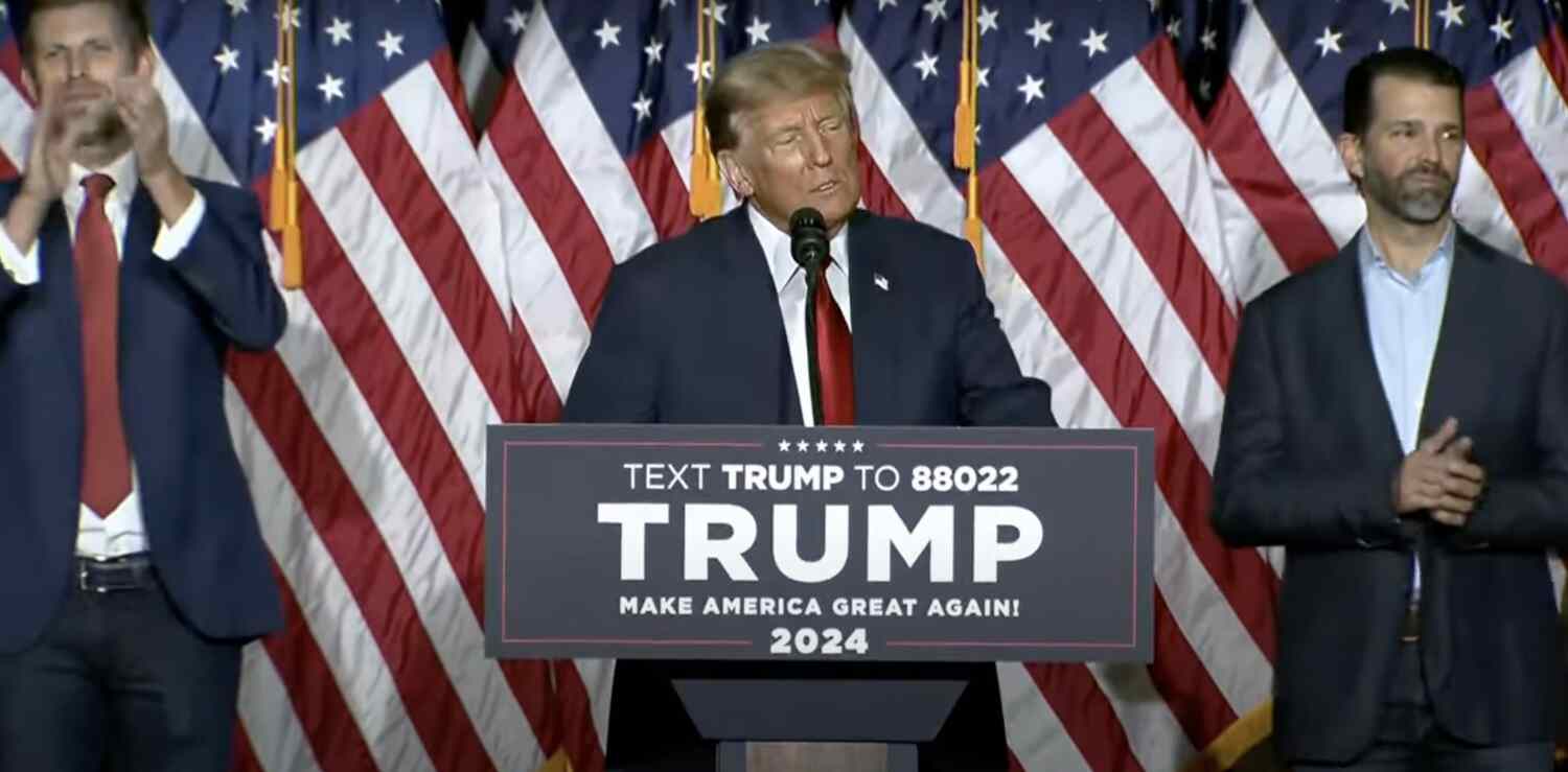Former president Trump at podium to make victory speech