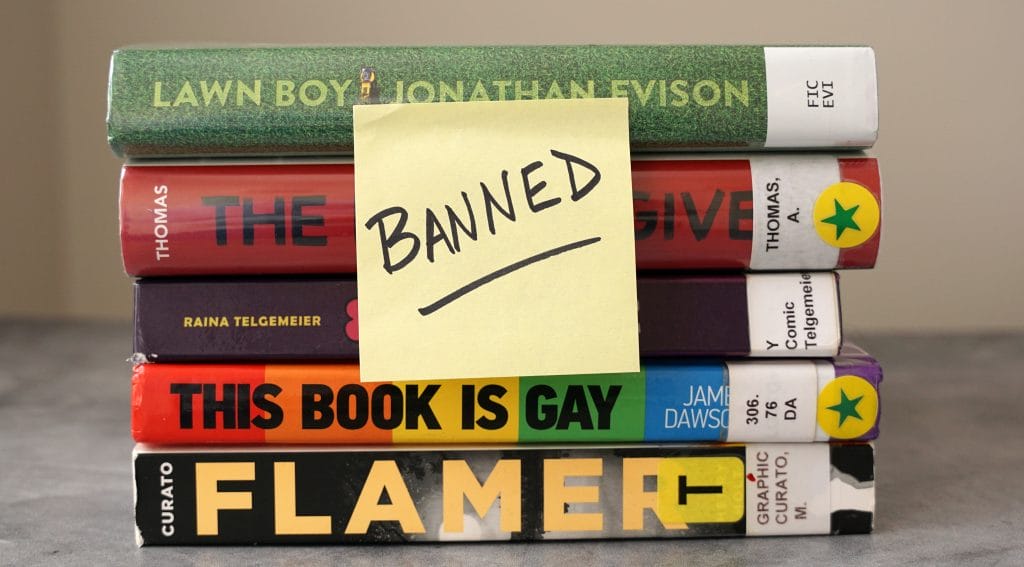 A collection of proposed LGBTQ books with a "banned" note on them