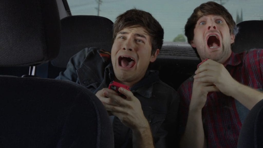 Anthony Padilla and Ian Hecox scream in the backseat of a car. Credit: Smosh Productions