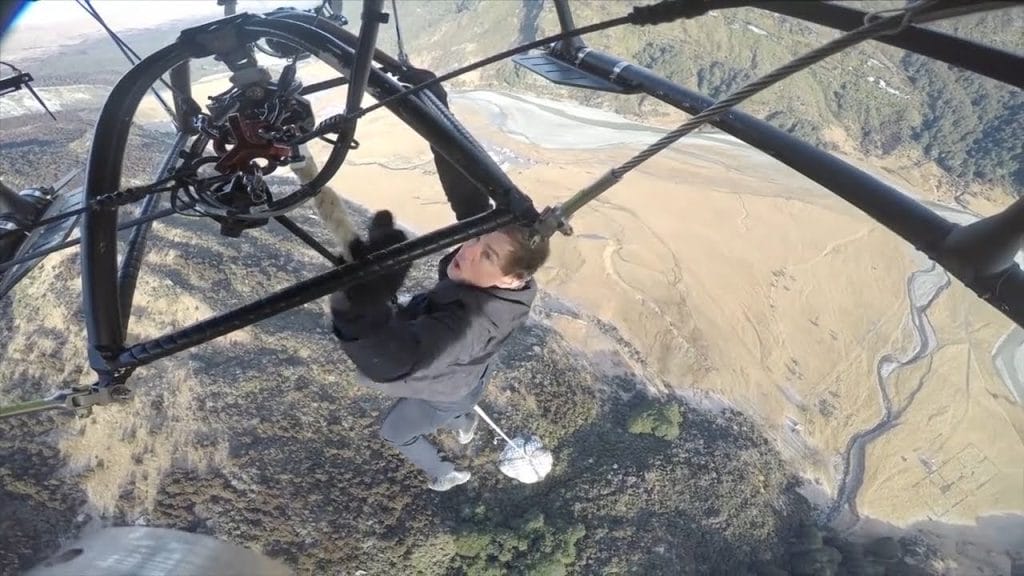 Tom Cruise hanging off a helicopter.