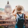 A woman who is on vacation and looking at an architecture.