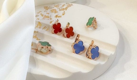 Three pairs of earrings on a plaster mold.