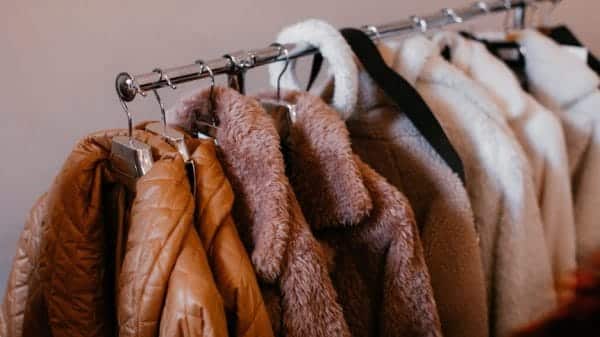 A rack of coats in different styles