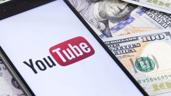 YouTube logo surrounded by dollar bills