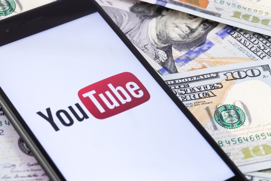 YouTube logo surrounded by dollar bills