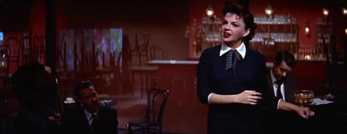 Esther Blodgett sings at a club late.