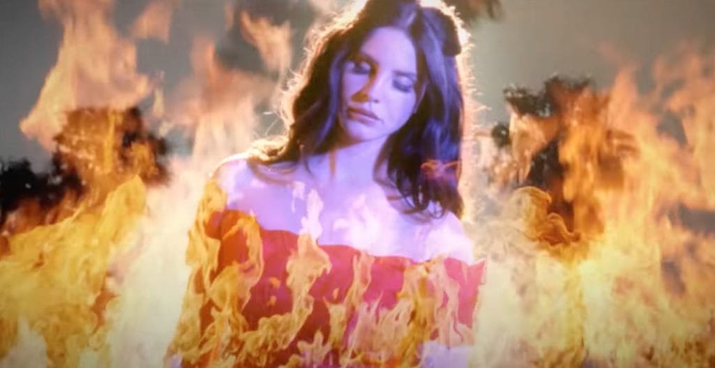 Lana Del Rey in her music video for "West Coast" from 2014. Lana dances in fire, this is an overlay and edited.