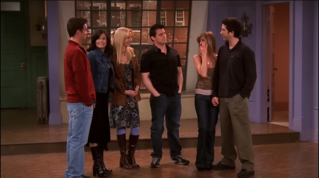 The six titular friends say goodbye for the last time in their empty apartment. 
