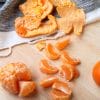 Oranges and peel on table