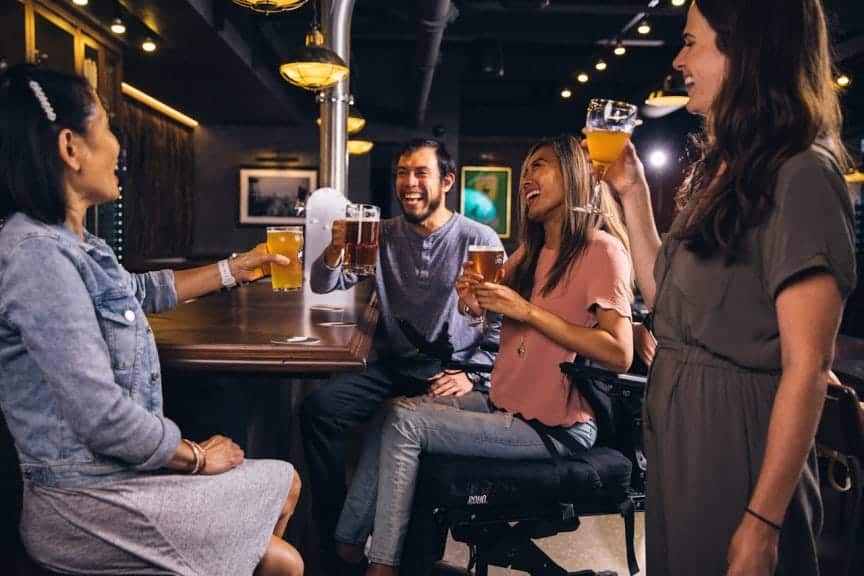 Group of friends drinking at a bar