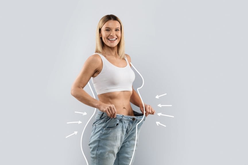 Fat-phobia - slender middle aged blonde woman wearing huge jeans, showing results of diet, white body shape lines around happy slim lady