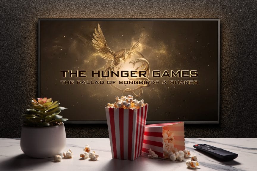 The Hunger Games: Ballad of Songbirds and Snakes plays on screen beyond popcorn and remote.