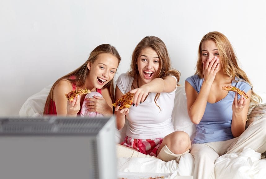 three friends watching the television