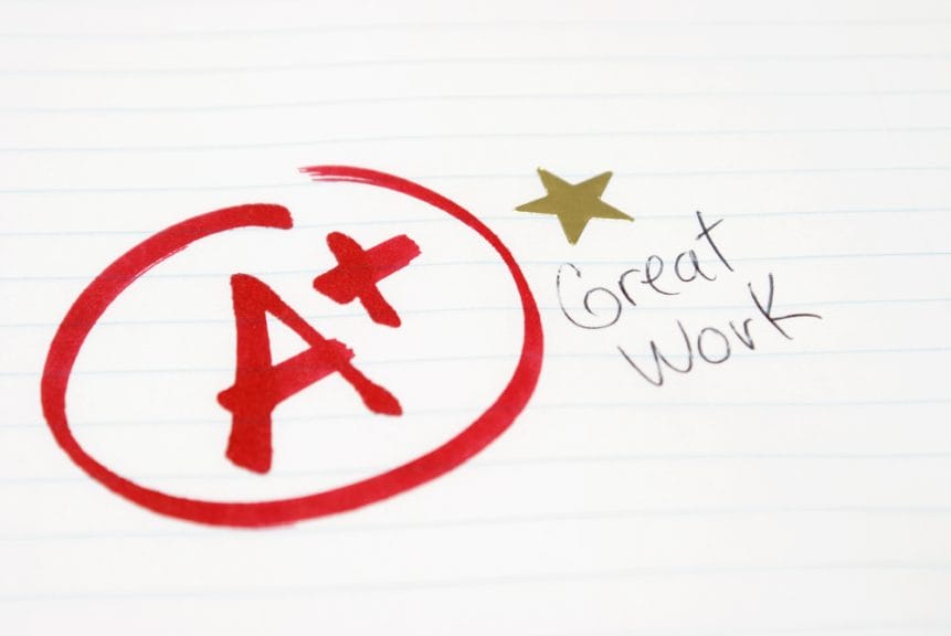 A plus written in red ink with a gold star and the phrase 'Great Work.' This is, of course, the symbol of an academic weapon.