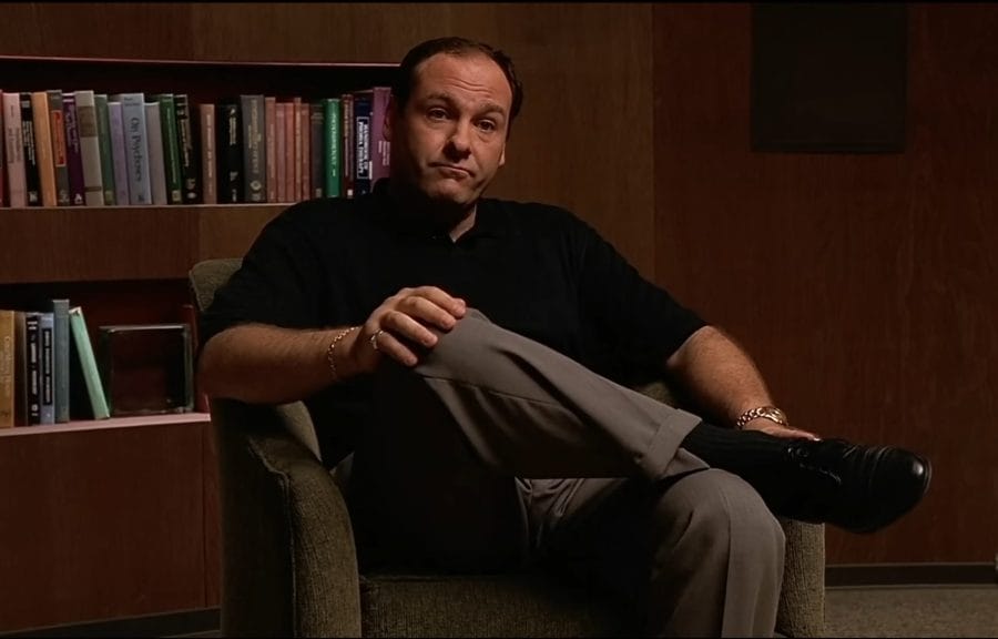 The main character, Tony Soprano, sits in a chair in his therapist's office.