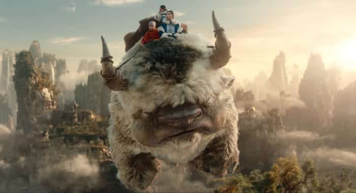 Aang takes his friends on a flying bison ride.