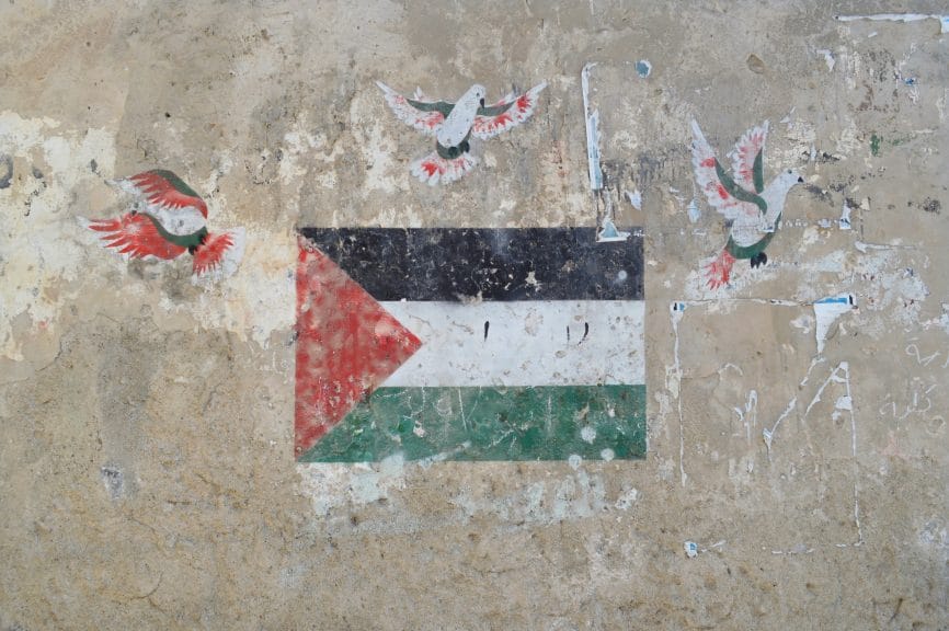 A mural of a Palestinian flag with birds around it painted on a wall as the boycotting continue.