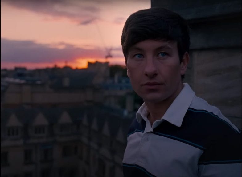 Ollie (Barry Keoghan) stands in front of the Oxford skyline