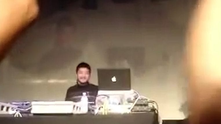 Jun Seba (or Nujabes) DJ'ing for a nightclub. The crowd is cheering.
