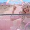 Margot Robbie as Barbie in the 2023 film Barbie singing in her car as she leaves Barbieland.