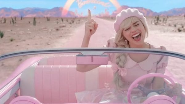 Margot Robbie as Barbie in the 2023 film Barbie singing in her car as she leaves Barbieland.