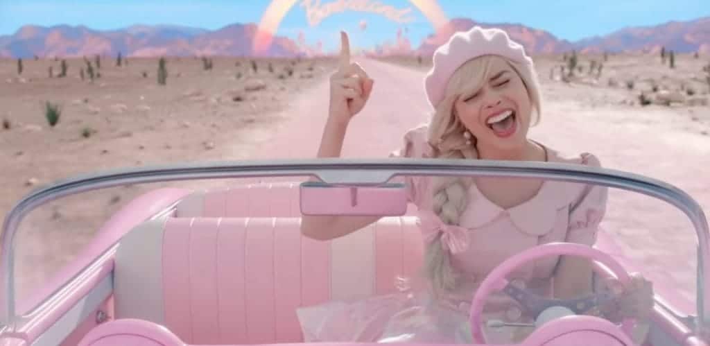 Margot Robbie as Barbie in the 2023 film Barbie singing in her car as she leaves Barbieland.