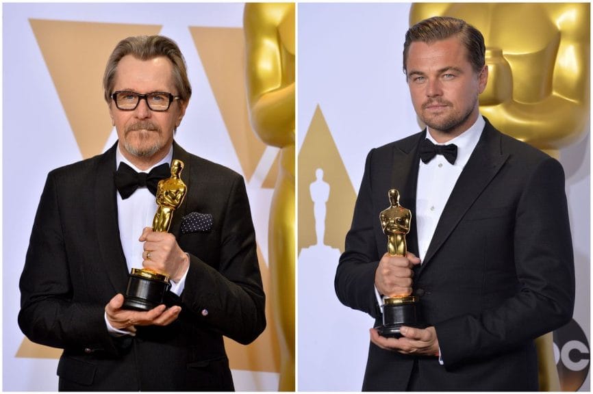 Two Actors holding their Oscar gold statues.