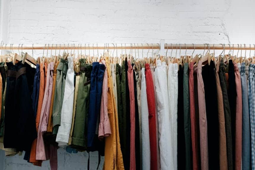 Various different clothing items hanging from a rail. Aesthetics.