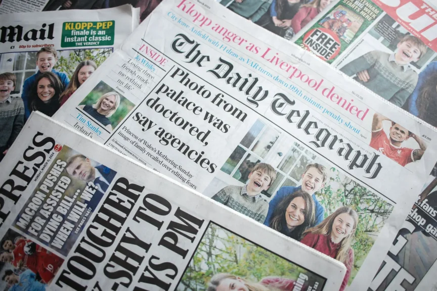 British newspaper front pages showing the image that news agencies said was digitally altered