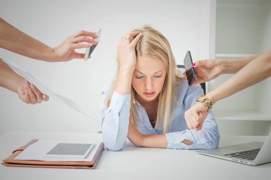 young women who is feeling stressed about the amount of work she is faced with