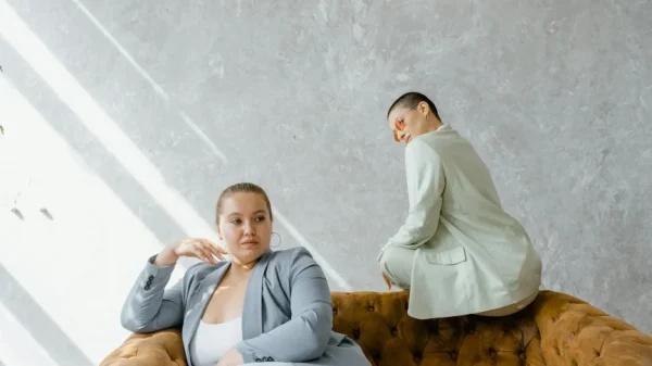 Two Women Sitting on a Couch