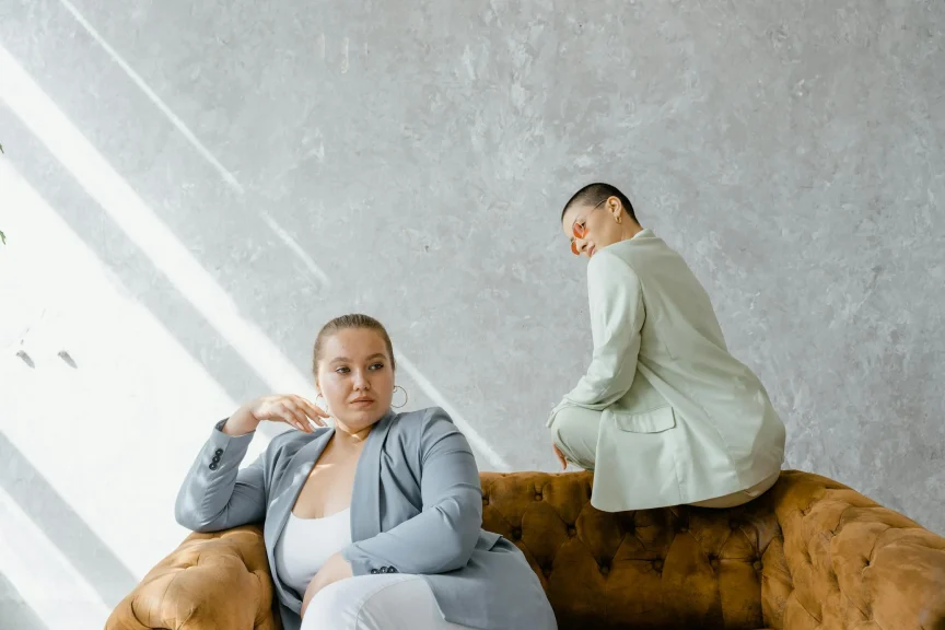 Two Women Sitting on a Couch