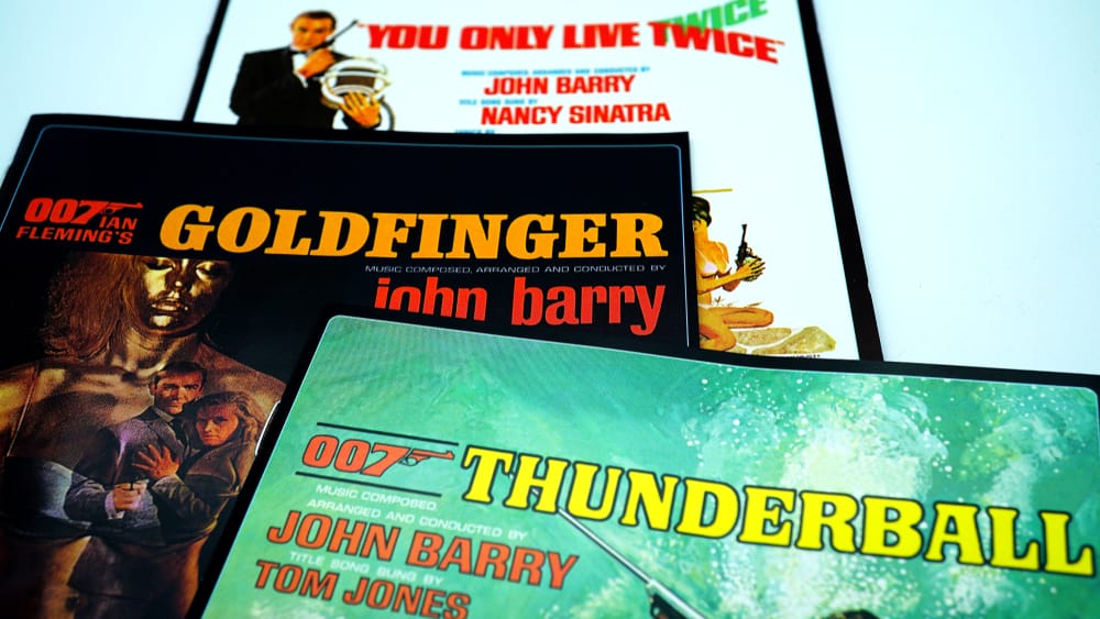 Image shows promotional flyers for Sean Connery Bond films.