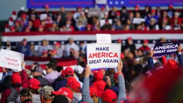 Men and women at Trump Rally. Conservative Men with traditional values and women in their soft girl era.