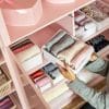 woman cleaning and organizing her closet