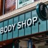 A green logo for The Body Shop on the front of a store.