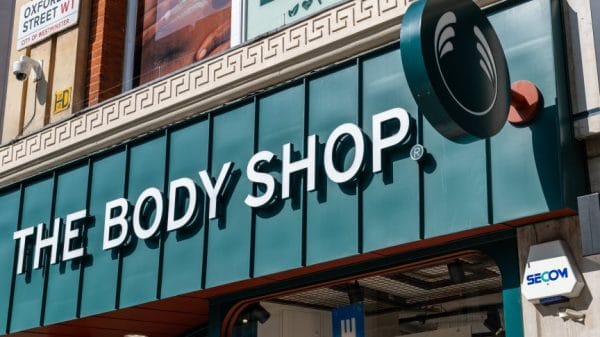 A green logo for The Body Shop on the front of a store.