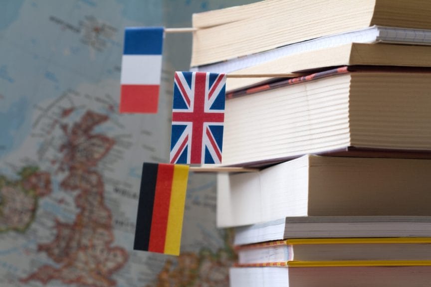 stack of books with flags sticking out