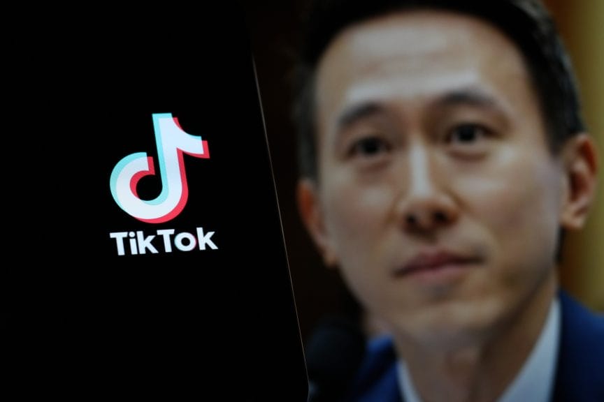 TikTok CEO Shou Zi Chew blurred, pictured beside TikTok logo