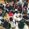 Group of college students sitting and studying.