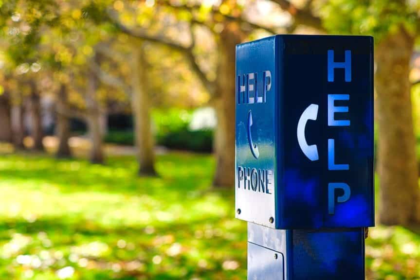 A sunny day, focused on a blue box with Help Phone written on the box. 