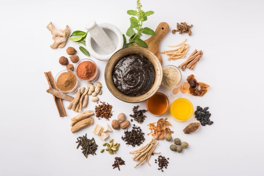 a white table full of Ayurvedic herbs and medicines