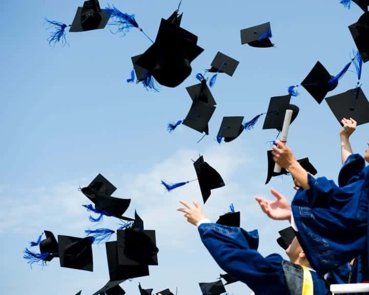 High school graduation, cap throwing.