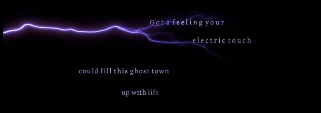 Screenshot from the Electric Touch lyric video - "Gotta feeling this electric touch / could fill this ghost town up with life"