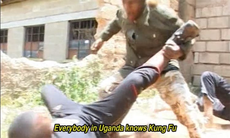 A fight breaks outside a building in Kampala, Uganda.