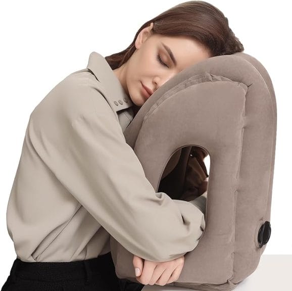 Woman laying on inflatable travel pillow